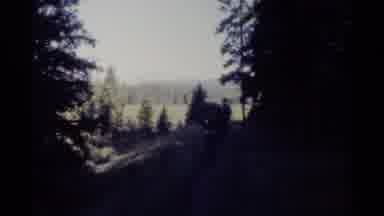 British Columbia Canada (1979): Three Hikers With Heavy Packs Hiking On A Trail