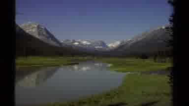 British Columbia Canada (1979): View Of Green Mountainside And Snow On A Clear