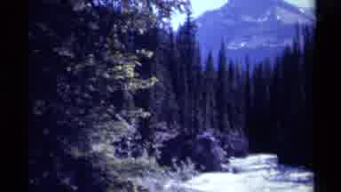 British Columbia Canada (1979): Child And Two Men Are Crossing The River