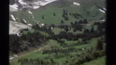 British Columbia Canada (1979): Backpacker Looking Down A Valley Towards A Dirt