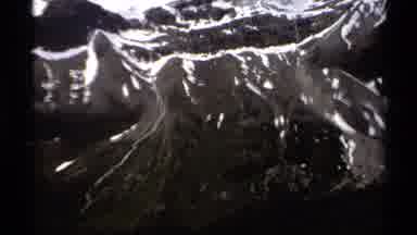 British Columbia Canada (1979): Two People With Backpacks Hike Through Green