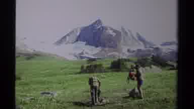British Columbia Canada (1979): Two Men Backpacking On The Mountain Side On A
