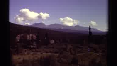 British Columbia Canada (1979): Cloudy Sky Behind Large Mountains Surrounding