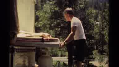 Mendocino California USA (1980): Man In Campground Pushing Mattresses Back Under