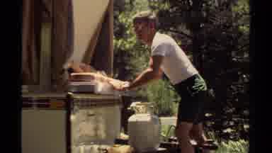 Mendocino California USA (1980): Man Having A Hard Time Sliding Tray Into The Back