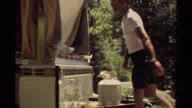 Mendocino California USA (1980): Outdoors Man Sets Up His Coleman Camper In
