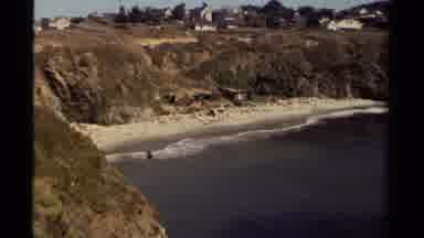 Mendocino California USA (1980): People Sunbathing On A Beach Watching The Shore
