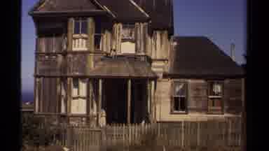 Mendocino California USA (1980): Old Wooden Two-Story House With Fence In Need Of