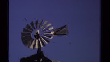 Mendocino California USA (1980): Windmill In Front Of A Blue Sky And A River With