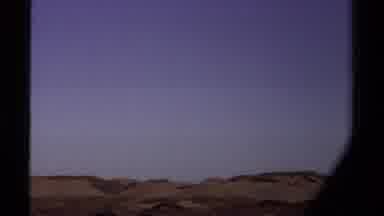Mendocino California USA (1980): Camera Zooms In On A Person Walking On A Large