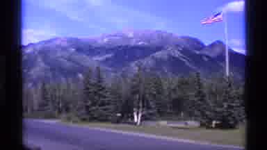 Alaska USA-1977: American Flag Dancing In The Wind With A Beautiful Mountain In