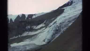 Alaska USA (1977): People Camping Near Snow Covered Mountain Canyon On Clear