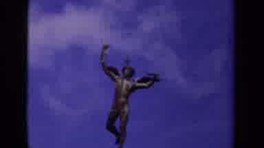 Paris France (1939): A Naked Statue Of An Angel Man And Then A Boat Passing Under