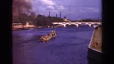 Paris France (1939): River Boat Moves Across Blue River Then Pans To Court House