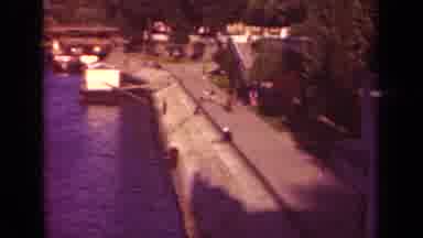 Paris France (1939): View Of Bridge Over Water And Civilians Walking By The Bay