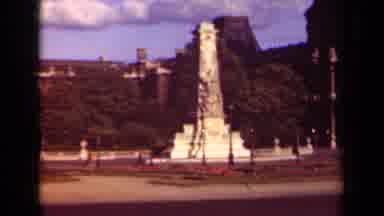 Paris France (1939): Square With Large Monument With People And Cars Passing By