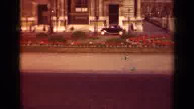 Paris France (1939): An Old Fashioned Black Car Is Moving Down The Street Having A