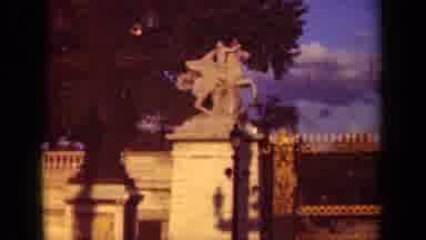 Paris France (1939): A Stone Statue Of A Man On A Horse Near A Decorative Fence