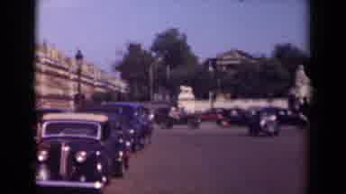 Paris France (1939): Vintage Automobiles Driving Down Busy Street From An Old