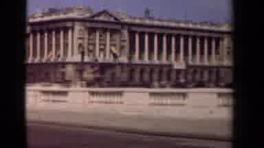 PARIS FRANCE-1939: Camera Pans Across A Large Historic Building As Cars