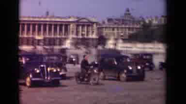 Paris France (1939): Person On Bike Glides Through On The Street In Historic Area