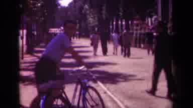 Paris France (1939): A Man Getting Off His Bike In The Middle Of A Large Crowd