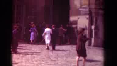 Paris France (1939): A Crowded Street Amid Buildings With Busy People Walking Down