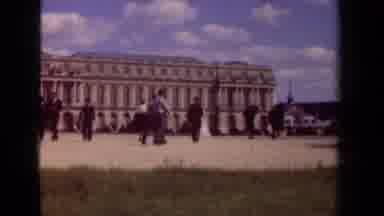 Paris France-1939: Tourists Walk By A Grand Historic Palace