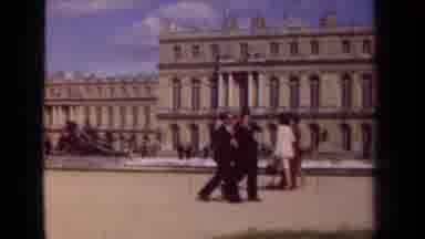 Paris France (1939): Groups Of People Walking By A Historic Looking Building