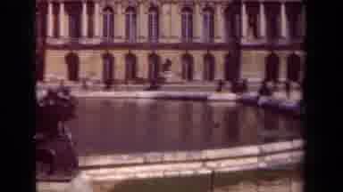 Paris France (1939): People Stroll Past A Water Fountain With A Pool And Statues