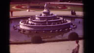 Paris France (1939): Man Walks Across Pavement Near Large Inactive Fountain And