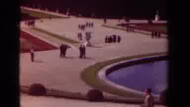 Paris France (1939): People Walking Around A Large Open Area That Contains A Large