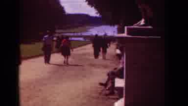 Paris France (1939): People Walking On Dirt Path On A Bright Sunny Day