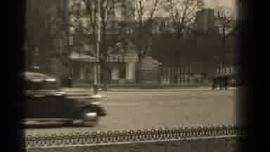 Paris France (1947): Old Car Driving Down The Street With People In Black Coats