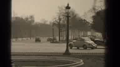 Paris France (1947): Antique Cars Zipping Around On The Road As People Walk By