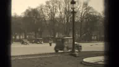 Paris France (1947): Antique Cars Driving Down The Road While Someone On An Old