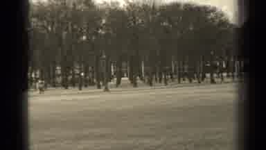 Paris France (1947): Footage Of A Park With A Large Buildings Many Trees And Cars