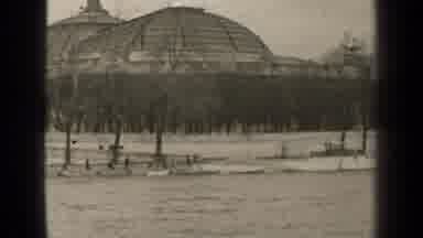 Paris France (1947): A Riverside View With A Large Building And Docked Boats