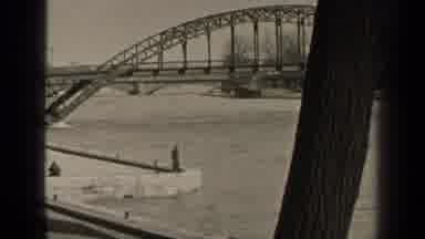 Paris France (1947): High Water Passes Underneath A Bridge On An Overcast Winter