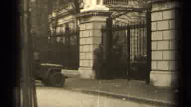 Paris France (1947): Man Walking Up To Large Metal Gate From Jeep In Long Overcoat