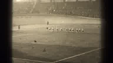 Paris France (1947): Several Men Run Across Some Sort Of Sports Field In A Stadium