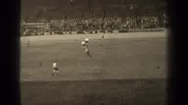 Paris France (1947): Group Of Two Teams Playing Soccer In Front Of A Crowd