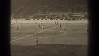 Paris France (1947): Both Teams Of Soccer Players Race Across The Field Towards