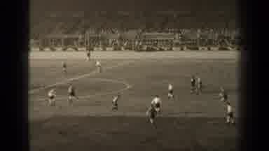 Paris France (1947): Football Player Kicks Ball On Field With Other Players During