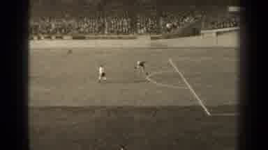 Paris France (1947): Vintage Soccer Game With Goalie Kicking Ball Past Half Field