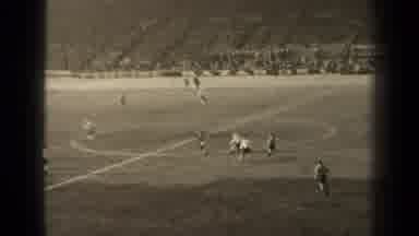 Paris France (1947): Adults Trade Soccer Ball From Opposite Team In Filled Stadium