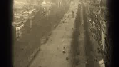 PARIS FRANCE-1947: A Busy City Street With Early Automobiles And Pedestrians