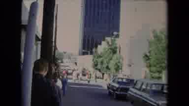 Los Angeles California USA (1967): People Walking In Group Cross City Road Near