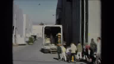 Los Angeles California USA (1967): People Walking By Open Truck Down An Alley With