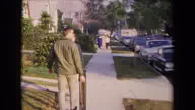 Los Angeles California USA (1967): Two Men Walking Down A Suburban Neighborhood